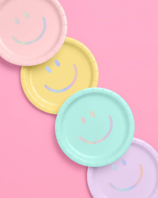 Pastel party supply kit with plates, napkins, balloons, straws, and curtains
