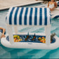 FUNBOY Floating Cabana Bar measuring nearly 6ft long, perfect for outdoor entertainers and summer parties. This inflatable drink station features a navy blue and white cabana stripe fabric sun shade that helps keep drinks and ice cold. With dual circular drink holders for ice or beverages and four additional cup holders, it’s ideal for mixing cocktails in the pool or setting up a pop-up drink station on a table.