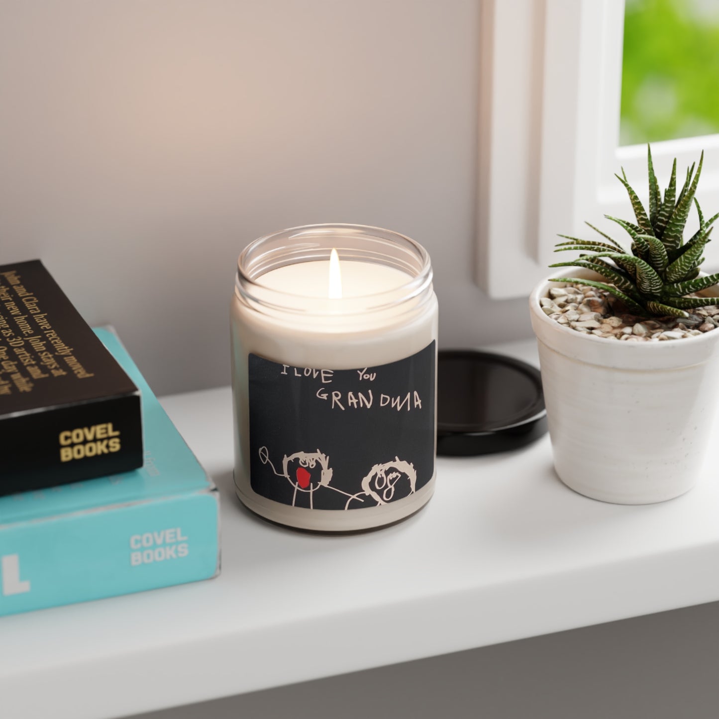 Customizable 9oz scented candle in a glass jar, made with 100% natural soy wax blend and featuring a 100% cotton wick. The candle includes a glossy permanent adhesive label for personalized artwork, available in various aromatic scents and has a burn time of 50-60 hours
