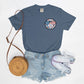 Retro smiley face sunglasses t-shirt featuring a patriotic design with American flag shades. Perfect for 4th of July celebrations, this vintage-style Comfort Colors tee is soft-washed, pre-shrunk, and available in unisex sizes. Show off 90s nostalgia with this fun and comfortable USA flag shirt, ideal for summer BBQs, fireworks, and family gatherings.