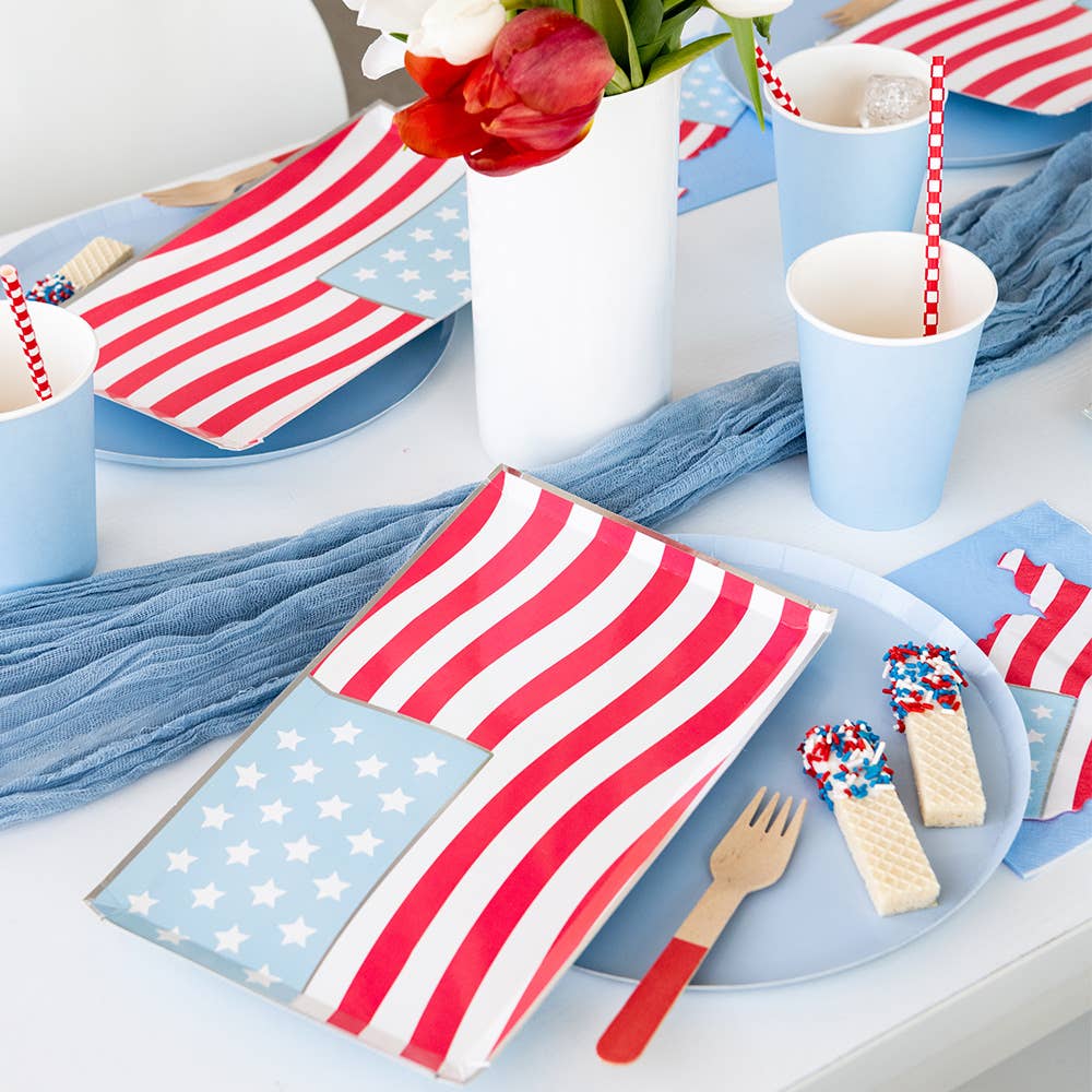 Red, white, and blue patriotic dinner plates with silver accents for 4th of July.
