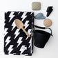 Sand-resistant kids beach towel folded with bag