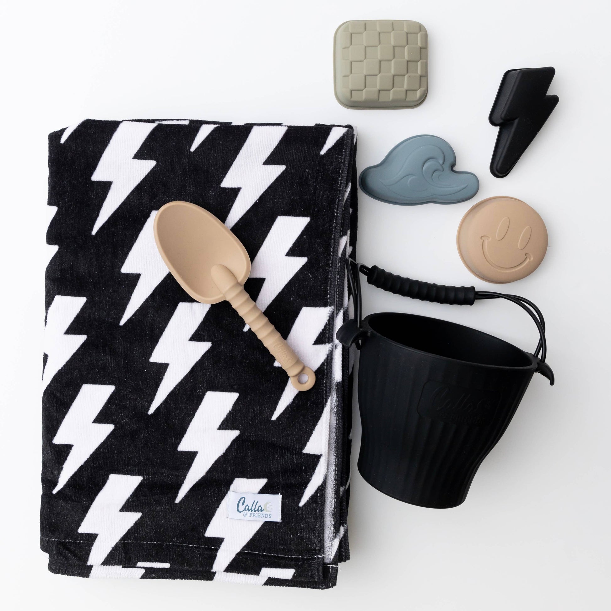 Sand-resistant kids beach towel folded with bag