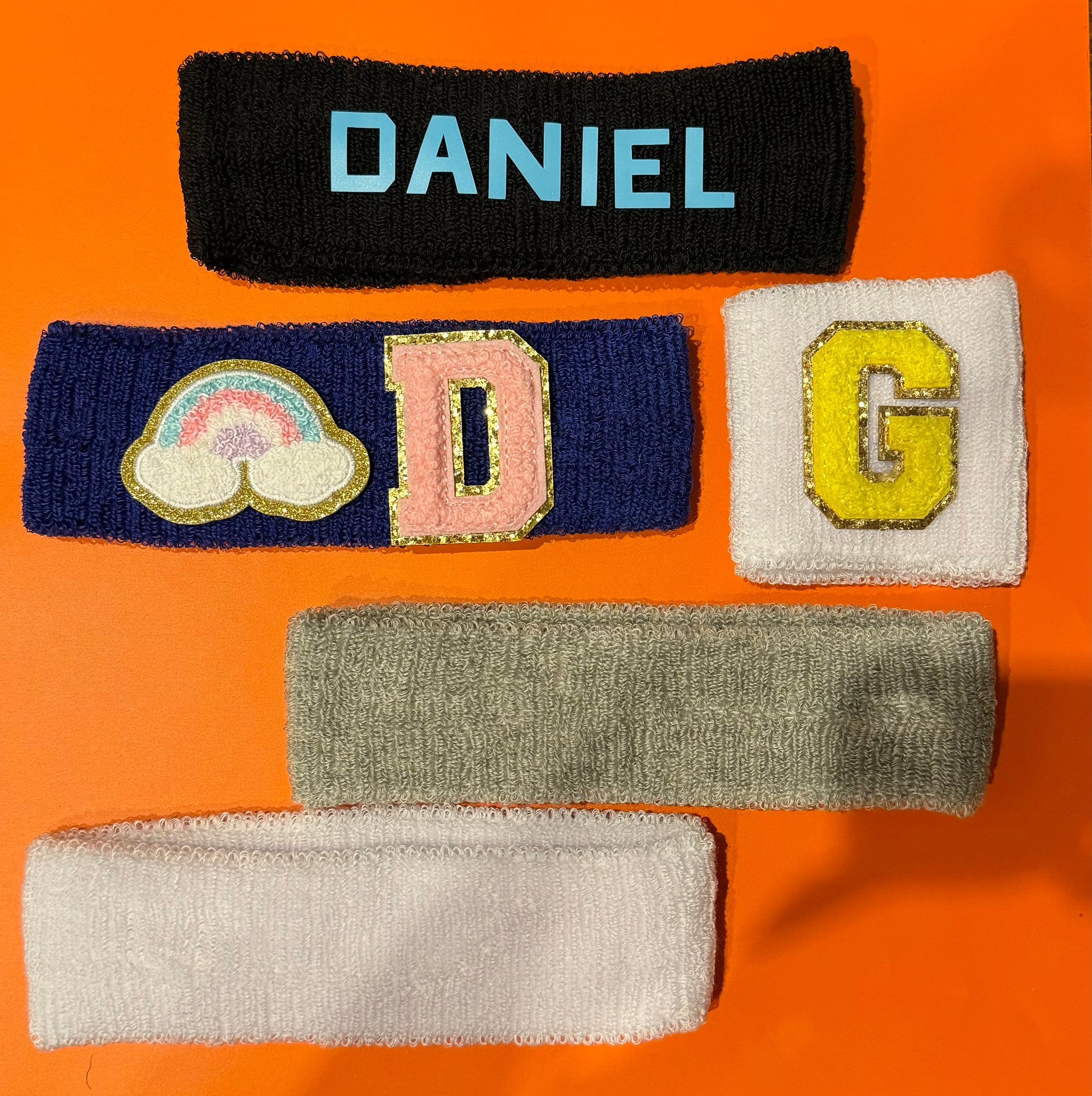 Personalized CGO 'Sweats' sweatband, designed to keep sweat and hair away during workouts. Stylish and unique, this sweatband is perfect for sports enthusiasts and makes a great party favor.