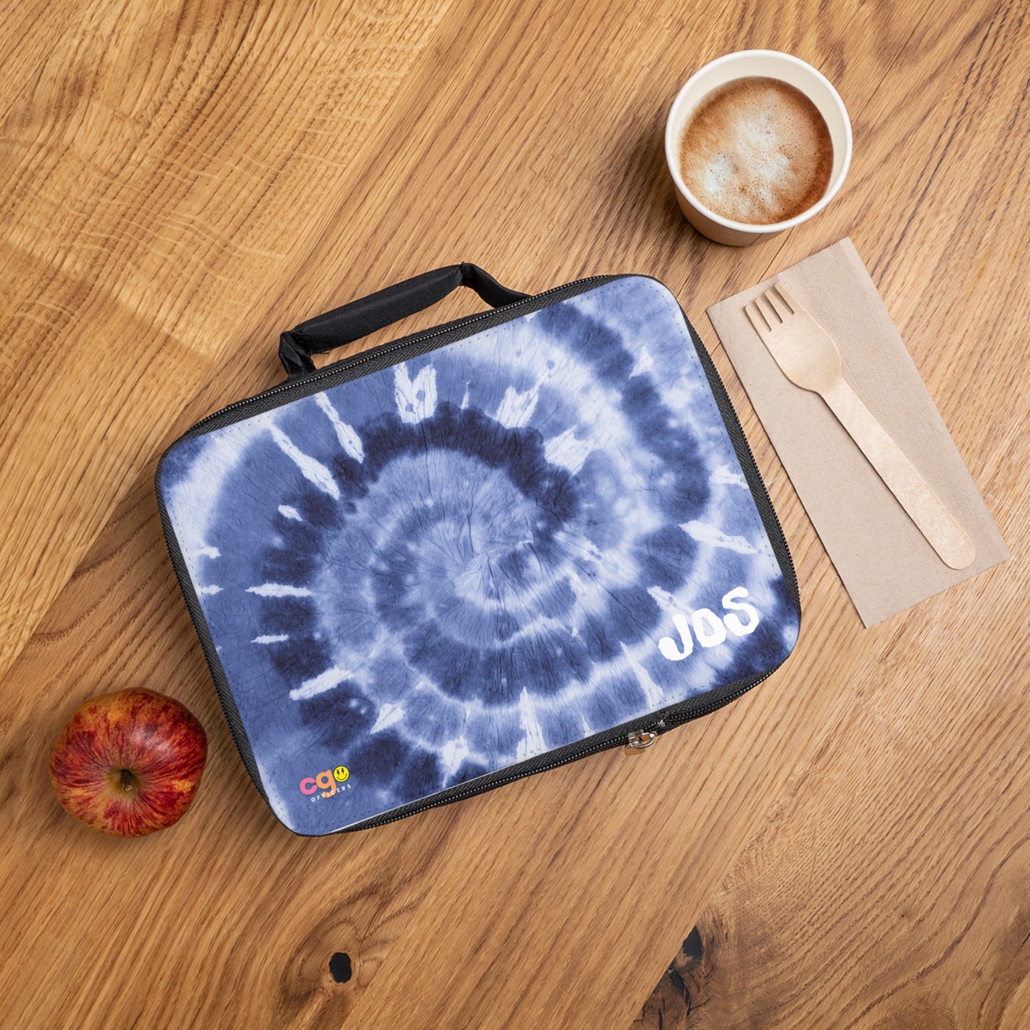 Blue tie-dye swirl insulated lunch bag for kids and teens, customizable with name, initials, or monogram. Perfect for school lunches and snacks, featuring a trendy 1990s-inspired design with easy zip closure and handles.