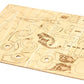 Wooden model kit with pre-cut pieces on a white background
