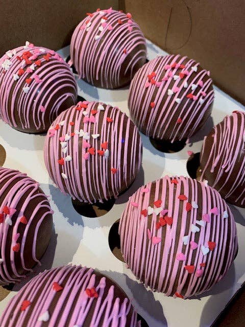 Box of four flavored hot cocoa bombs for cozy drinks