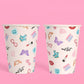 White paper cups with 13, snakes, and butterflies