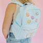 Solid backpack perfect for school, gym, or travel. Features easy clean lining and a spot clean exterior. Dimensions are 16" x 11" x 5", making it ideal for students and everyday use. Durable and versatile for multiple occasions.
