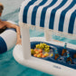 FUNBOY Floating Cabana Bar measuring nearly 6ft long, perfect for outdoor entertainers and summer parties. This inflatable drink station features a navy blue and white cabana stripe fabric sun shade that helps keep drinks and ice cold. With dual circular drink holders for ice or beverages and four additional cup holders, it’s ideal for mixing cocktails in the pool or setting up a pop-up drink station on a table.