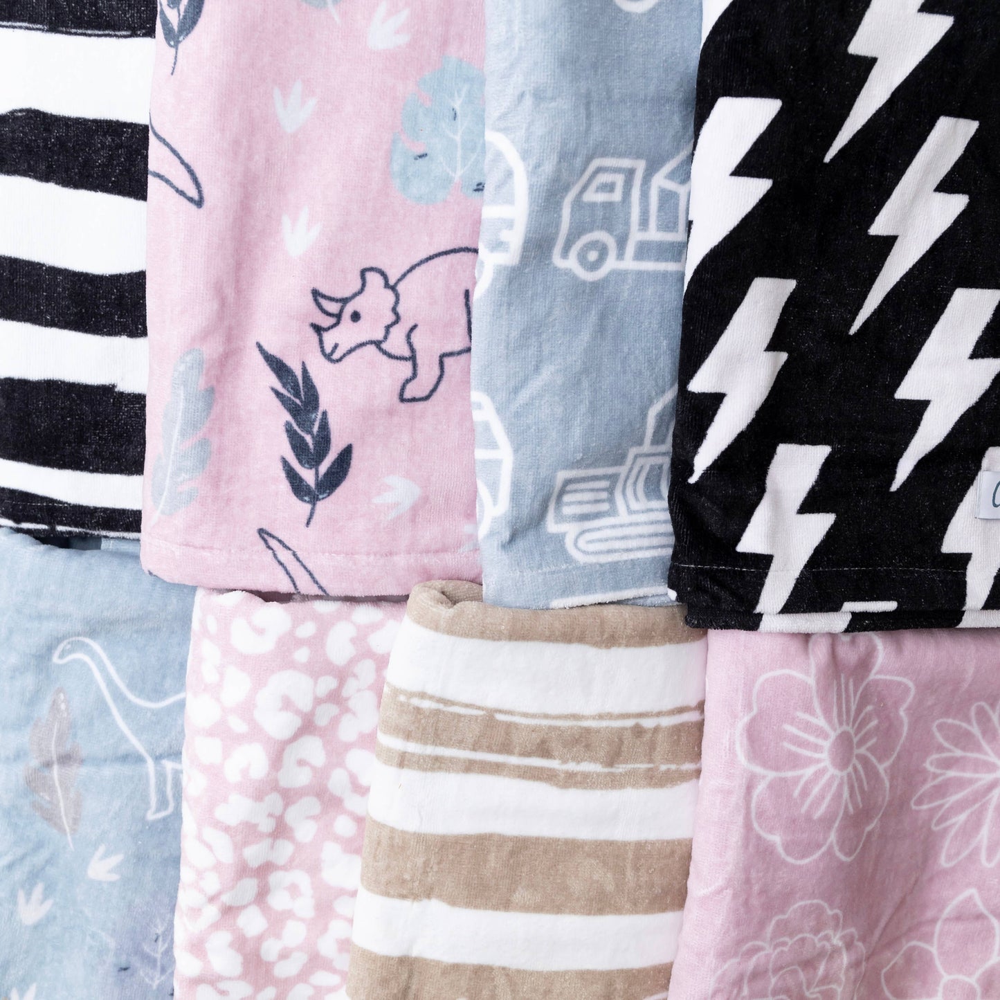 Collection of patterned fabric swatches in various colors and designs.