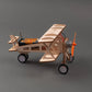 Child assembling wooden airplane with propeller
