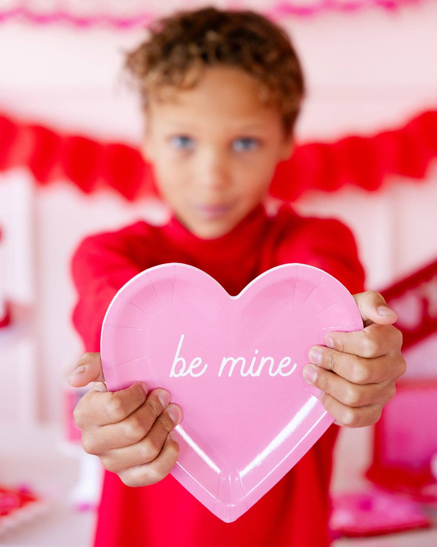 Red and pink heart-shaped plates with love messages