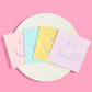 Rainbow foil curtain with pastel balloons and smiley plates