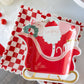 A festive paper plate featuring Santa Claus in his sleigh, perfect for holiday gatherings and celebrations.