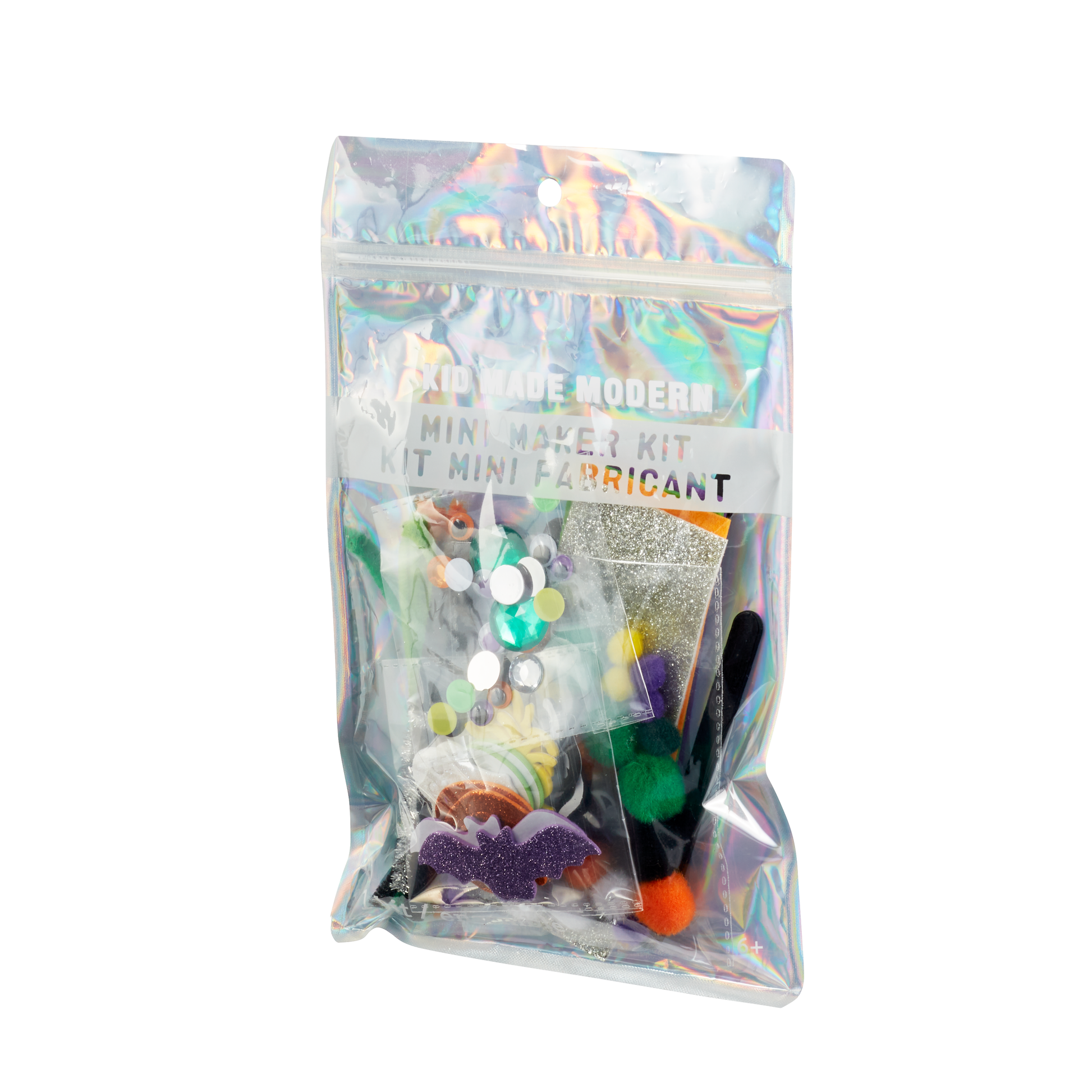 Halloween Mini Maker Kit for kids, featuring a resealable iridescent pouch filled with fuzzy sticks, pom poms, googly eyes, craft supplies, and foam stickers for creative Halloween crafting fun. Perfect for ages 6 and up.