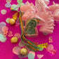 Unicorn-themed candy favor in a magical candy box featuring rainbow sour candy tails. Perfect for birthday parties and kids' celebrations. Enjoy a delightful sensory adventure with this fun and whimsical treat. Color may vary from photos.