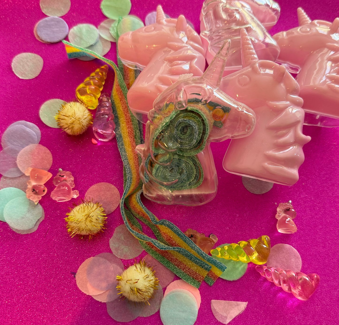 Unicorn-themed candy favor in a magical candy box featuring rainbow sour candy tails. Perfect for birthday parties and kids' celebrations. Enjoy a delightful sensory adventure with this fun and whimsical treat. Color may vary from photos.