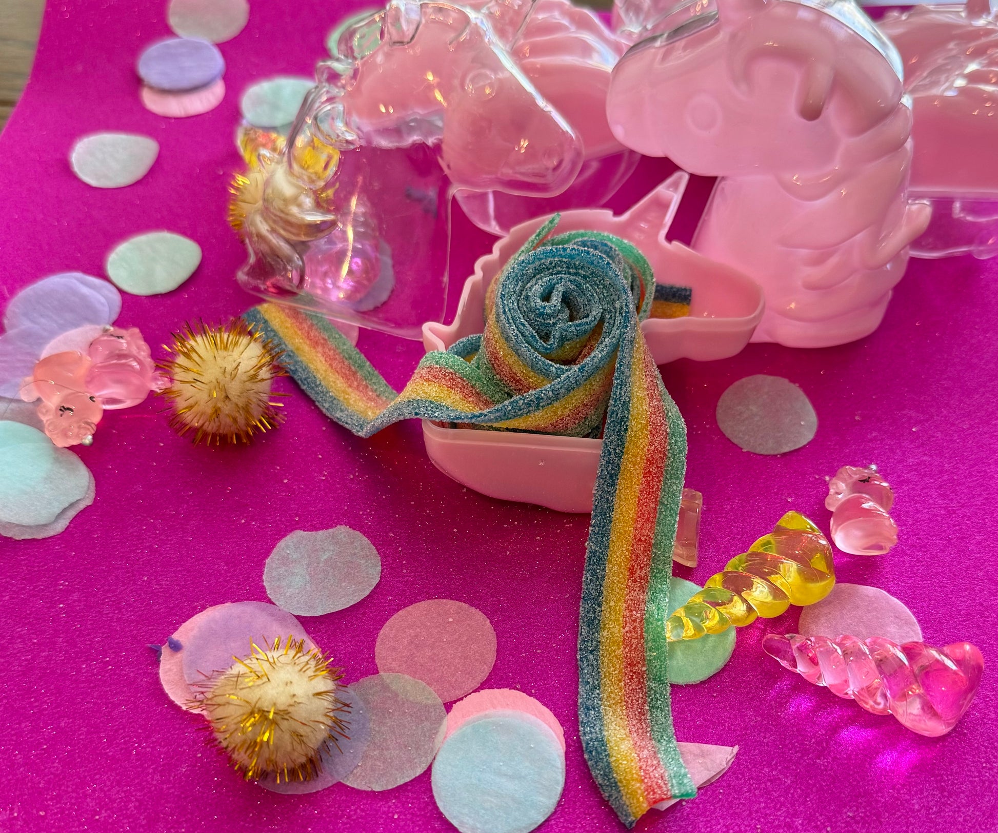 Unicorn-themed candy favor in a magical candy box featuring rainbow sour candy tails. Perfect for birthday parties and kids' celebrations. Enjoy a delightful sensory adventure with this fun and whimsical treat. Color may vary from photos.