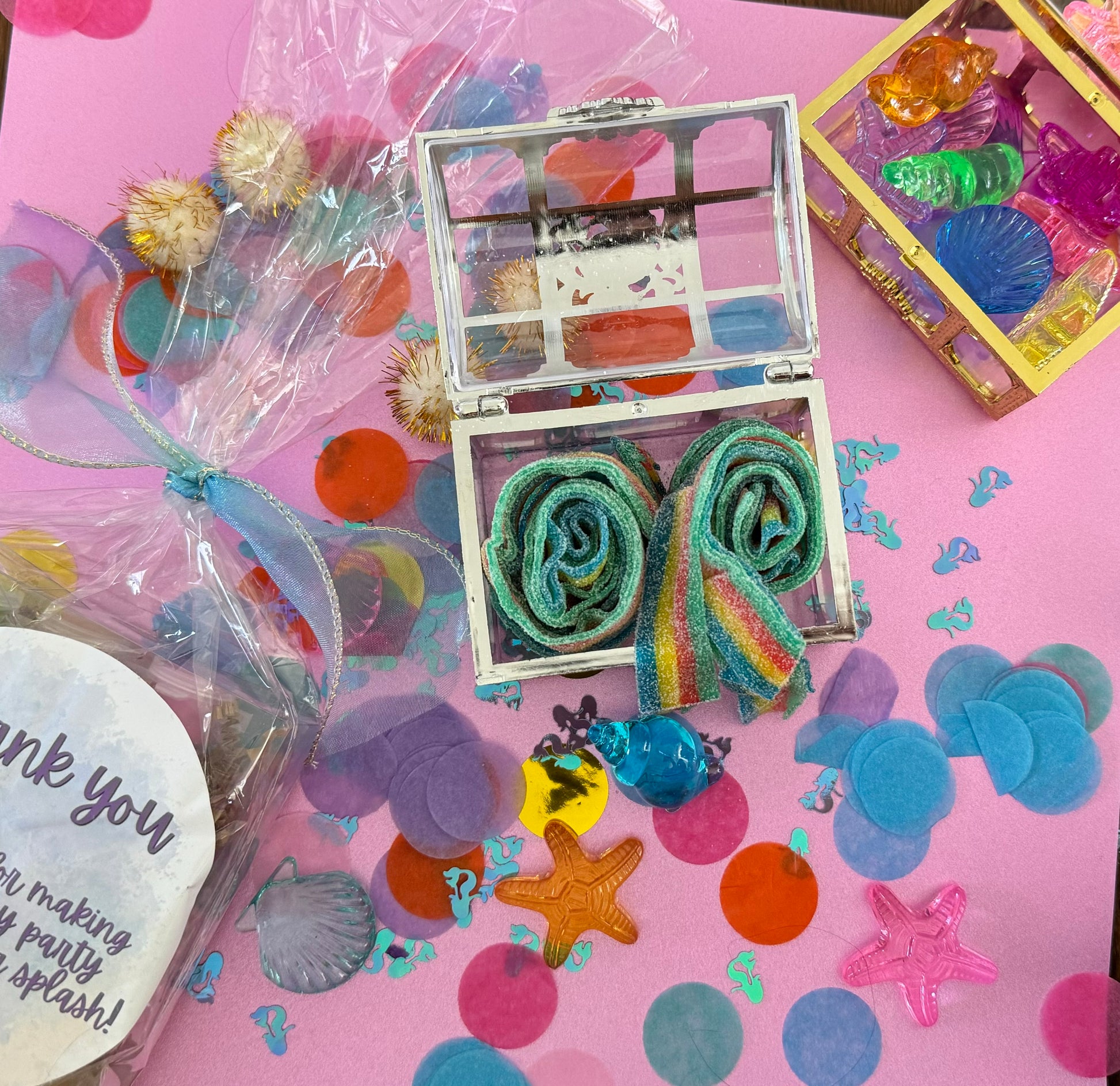 Magical Mermaid Candy favor in a gold or silver treasure chest, featuring rainbow mermaid tail candy with a sour punch. Perfect for under-the-sea or birthday party themes. Colors may vary from photos due to manufacturing differences