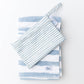 Blue striped Kenzie Beach Towel with matching wet bag on sand