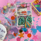 Magical Mermaid Candy favor in a gold or silver treasure chest, featuring rainbow mermaid tail candy with a sour punch. Perfect for under-the-sea or birthday party themes. Colors may vary from photos due to manufacturing differences