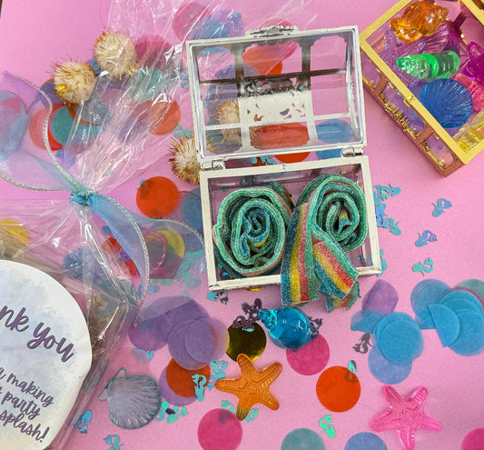 Magical Mermaid Candy favor in a gold or silver treasure chest, featuring rainbow mermaid tail candy with a sour punch. Perfect for under-the-sea or birthday party themes. Colors may vary from photos due to manufacturing differences