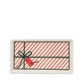 Rectangular ceramic tray with a red and white striped design and a green bow on a white background