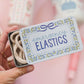 "Tie It Back" 🎀 Emergency Hair Ties Travel Tin (20 Elastics) by Pippi Post