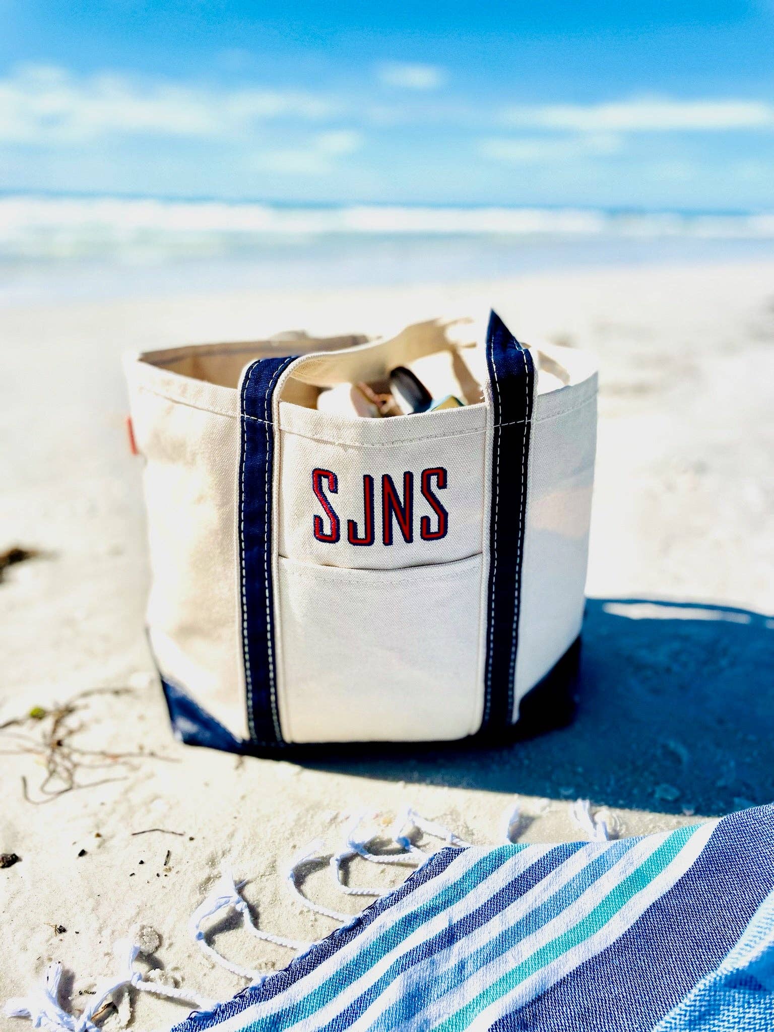 Classic boat tote bag with zip top, durable cotton canvas, roomy in hot pink, navy, coral