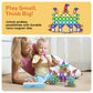 Toddler building tiles for quiet play on the go