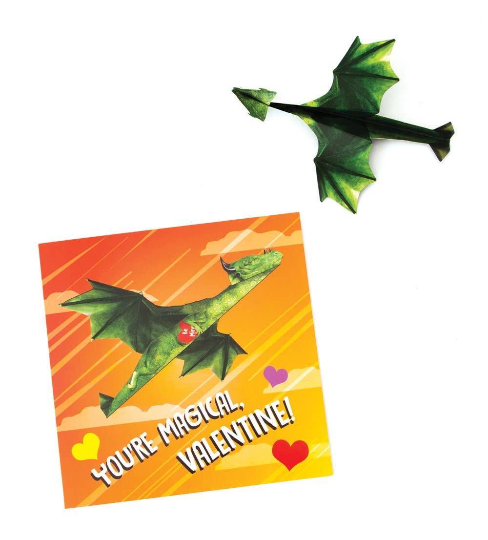 Kids launching flying dragon Valentine toys outdoors