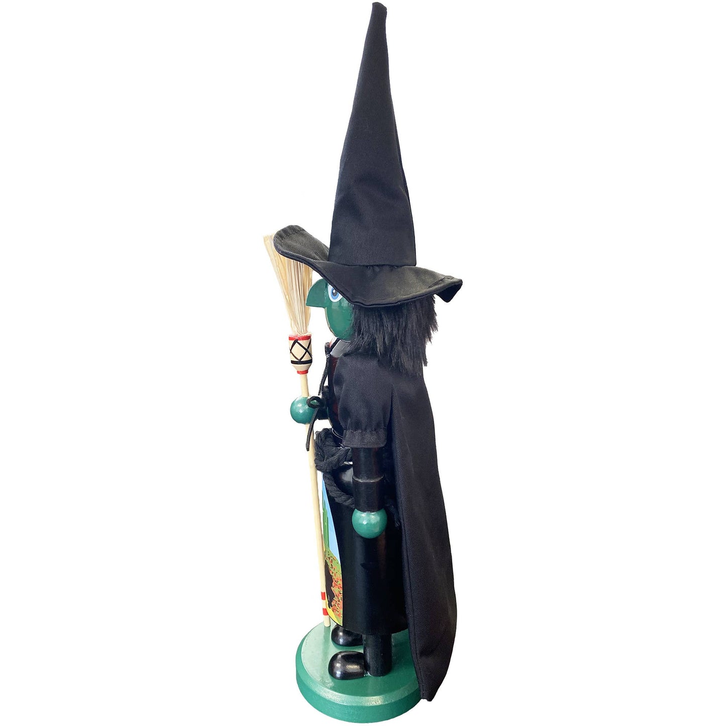 Wooden witch nutcracker in spooky green and black outfit