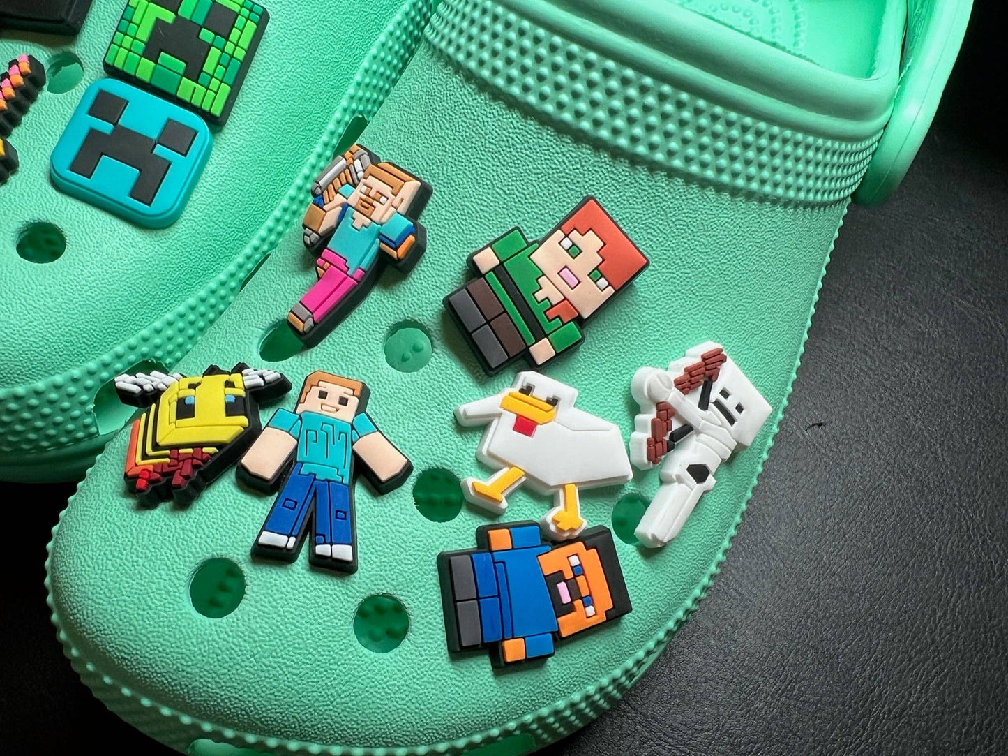 Rubber-backed secure shoe charm for crocs