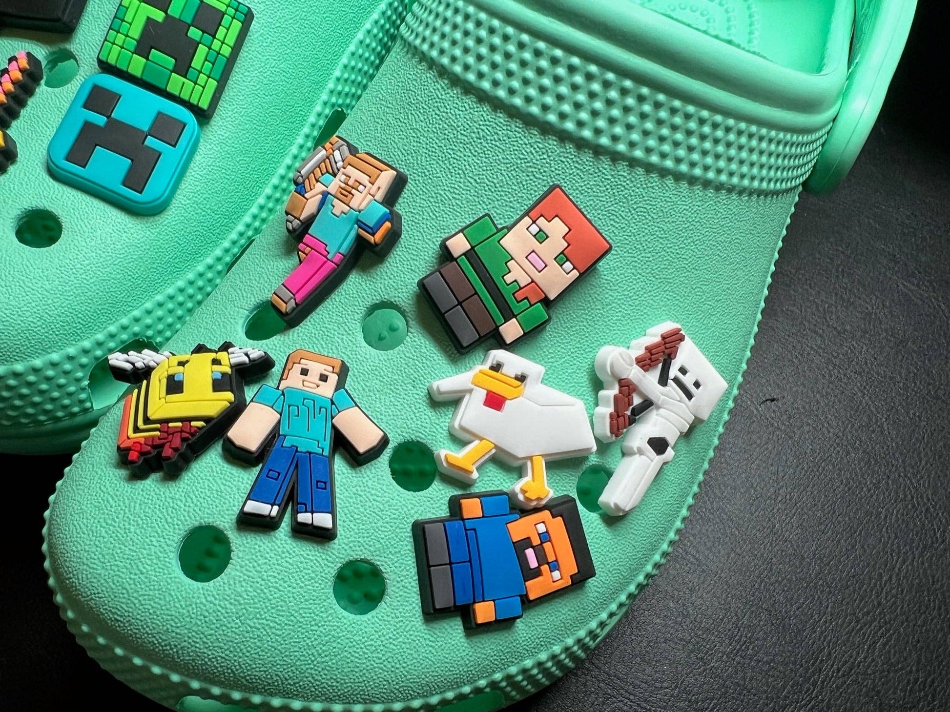 Rubber-backed secure shoe charm for crocs