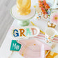 Celebrate with Occasions By Shakira cocktail napkins, 18-pack, gold foil 'You Did It' design.