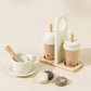 Wooden Coffee Maker Playset for kids with 4 coffee pods, cup, plate, spoon, cup holder, and 2 to-go cups. Perfect for imaginative play, allowing children to role-play as baristas, creating cappuccinos, lattes, and more. Encourages creativity and motor skills development.