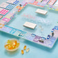 “Monopoly, But Make It Chic” ✨ Aura Collection Glass Monopoly Game