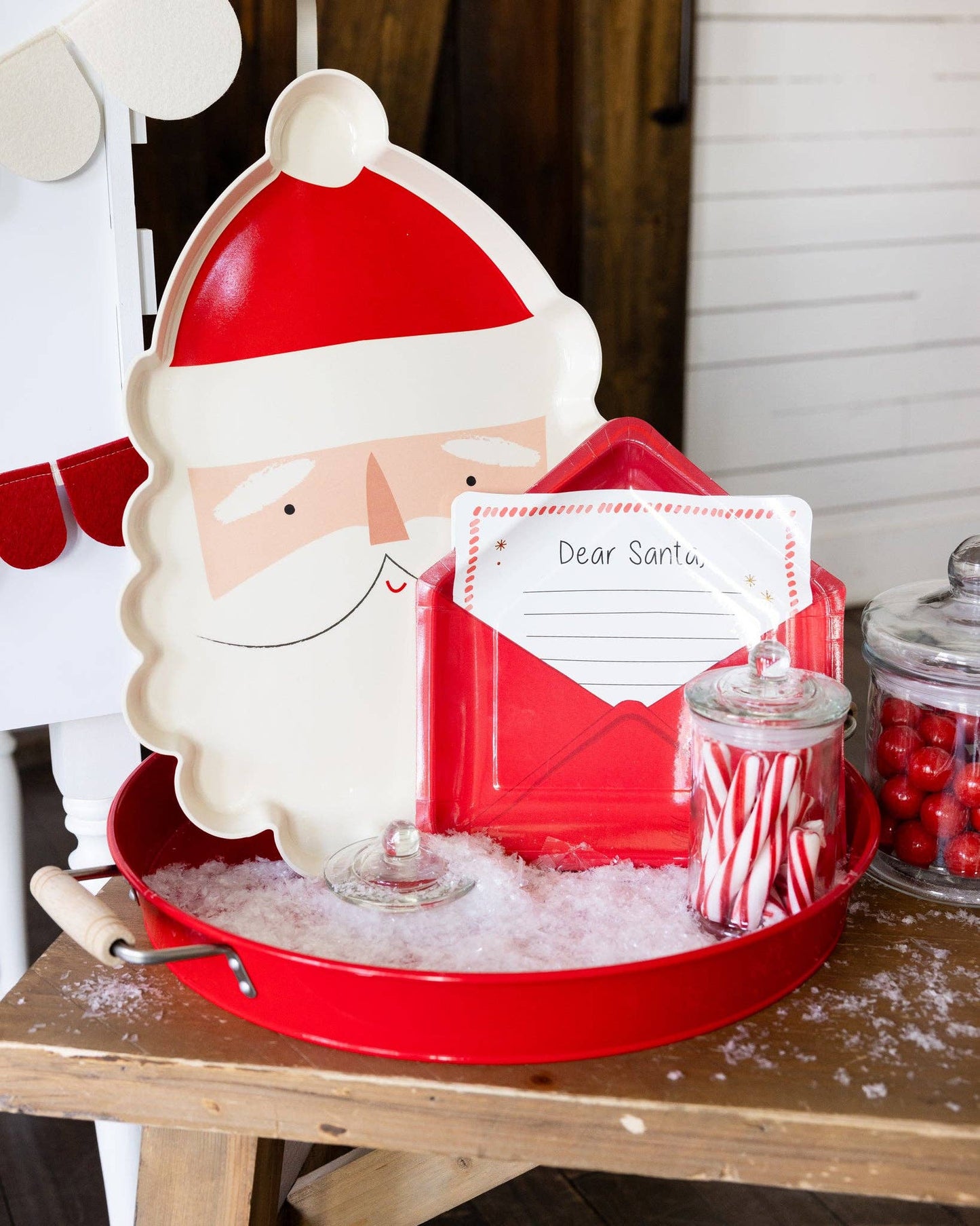 Whimsical "Dear Santa" paper plates for holiday meals. Shaped like a letter to Santa in an envelope, perfect for kids and adults. Includes 8 plates (9.5" x 9"), ideal for festive gatherings. Santa-approved design for a fun, memorable table setting.