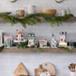 Glitter Christmas village building with warm light