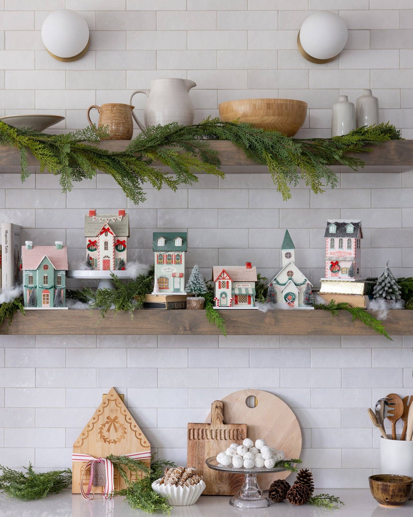 Glitter Christmas village building with warm light