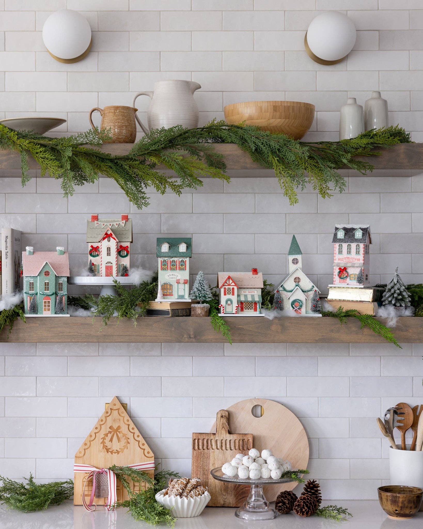 Glitter Christmas village building with warm light