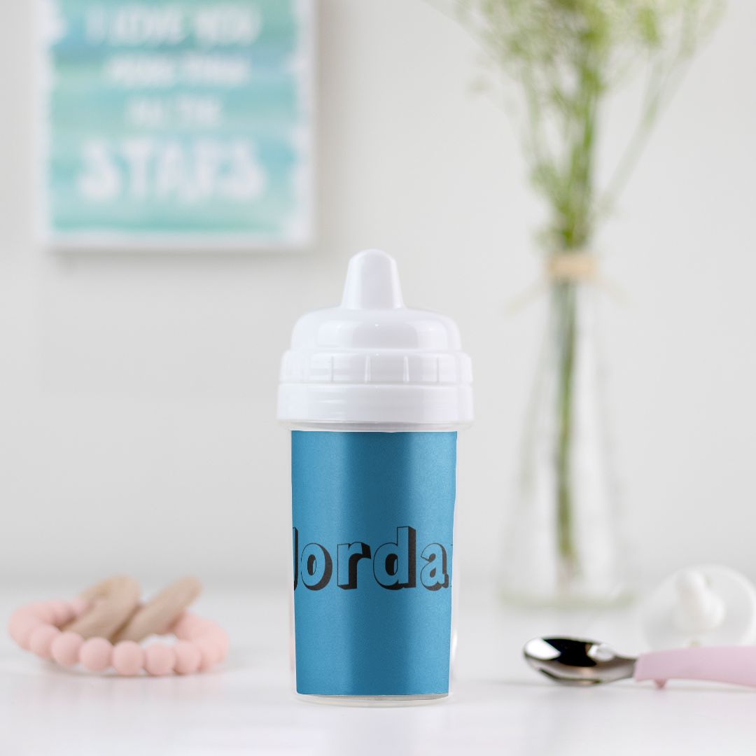 Spill-resistant toddler cup made from BPA-free plastic, ideal for active little ones. Features a one-sided design and removable insert for easy cleaning.
