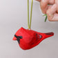 Cardinal bird ornament painted red with custom details