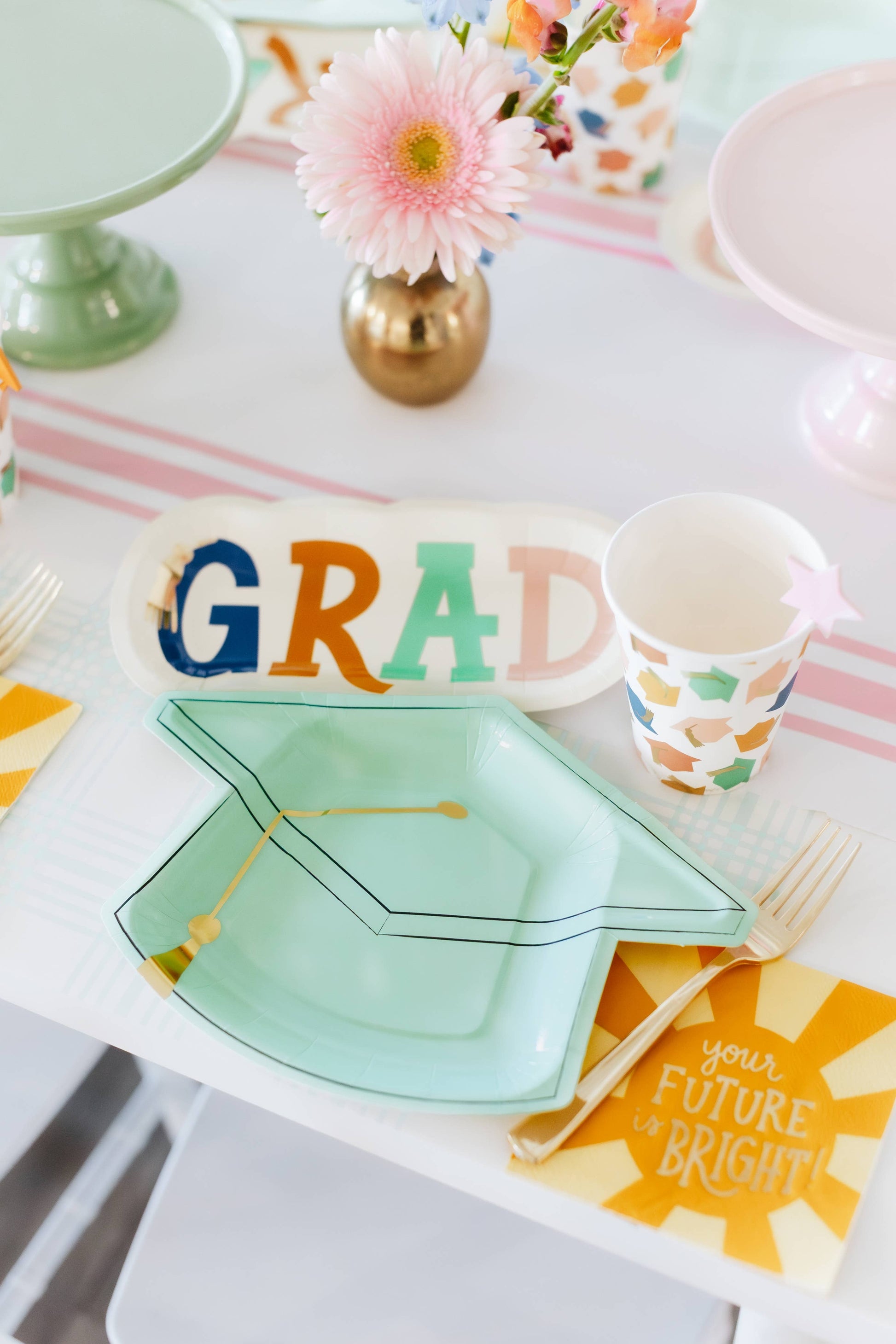 Occasions By Shakira grad napkins, 18-pack, 5” x 5” with gold foil, perfect for grad parties.