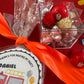 Delight in our Firetruck Themed candy favor, perfect for birthdays and firehouse play dates. This magical treat comes in a perfectly sized square plastic box filled with chocolate 'kisses' themed with firetruck labels. Each box is wrapped in cellophane and can include a thank you label. Explore more candy container options. Ideal for fire truck, firefighter, and tractor-themed parties, ensuring a delicious and fun addition to your celebration.