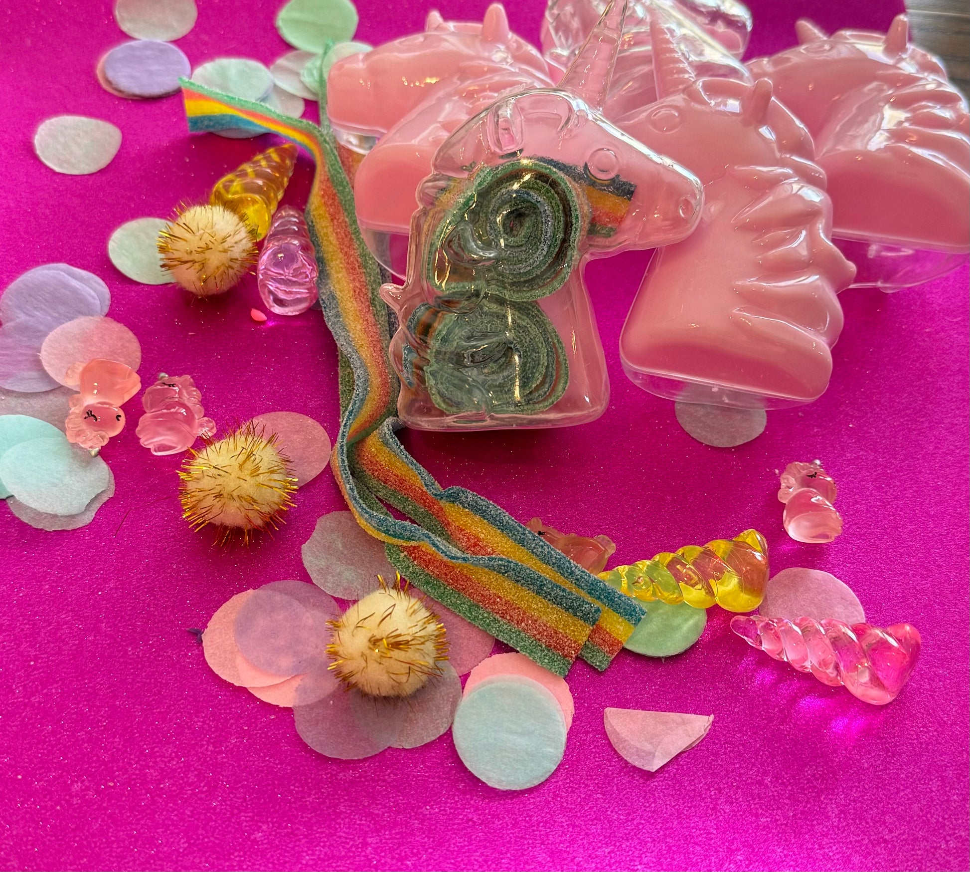 Unicorn-themed candy favor in a magical candy box featuring rainbow sour candy tails. Perfect for birthday parties and kids' celebrations. Enjoy a delightful sensory adventure with this fun and whimsical treat. Color may vary from photos.