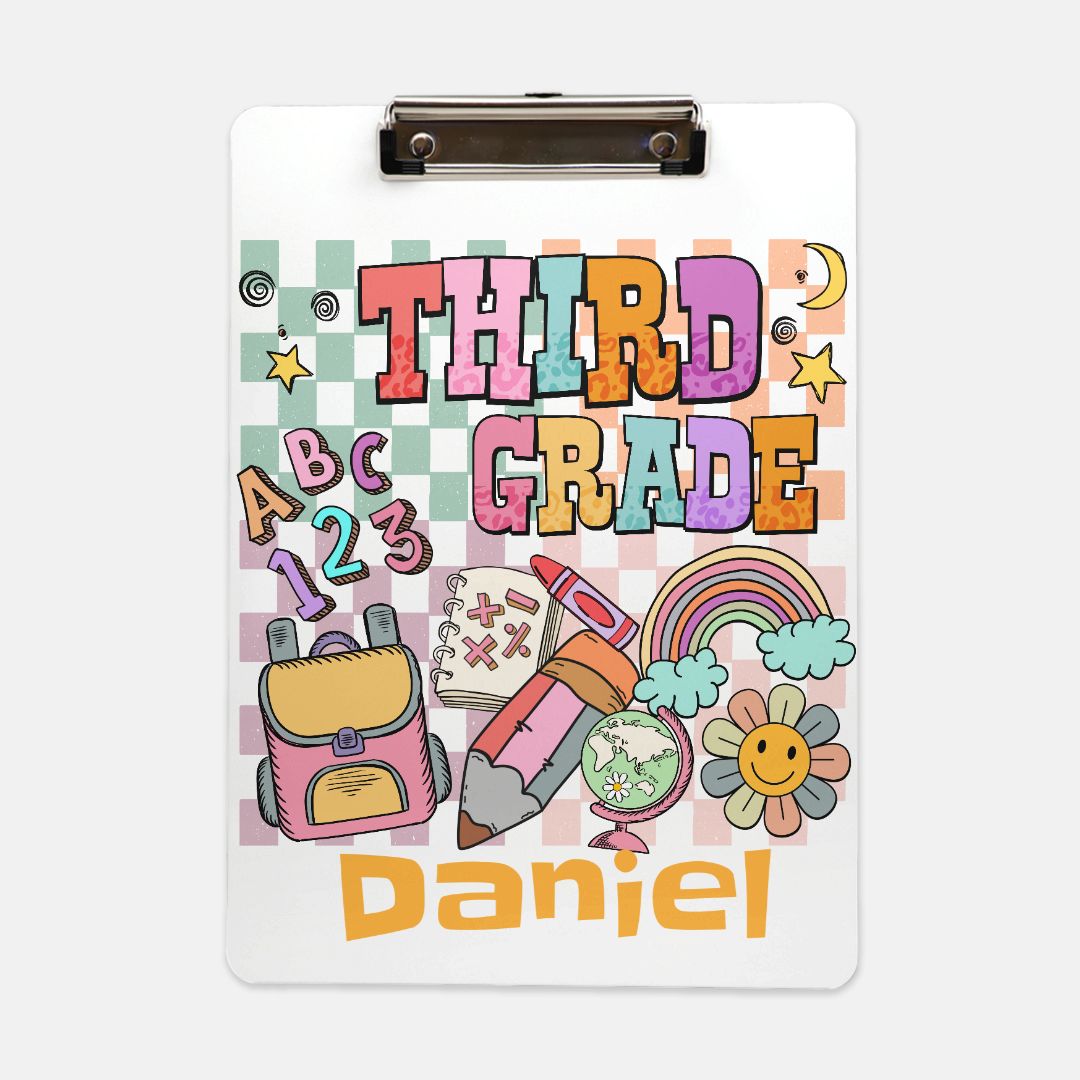 Personalized Custom Clipboard for Third Graders, featuring a cheerful design and available in various colors. Perfect as a back-to-school gift, this clipboard is ideal for organizing documents, homework assignments, and notes. It makes a great gift for teachers and teaching assistants, combining functionality with fun schoolhouse art. Customize it with your child's name for a unique touch!