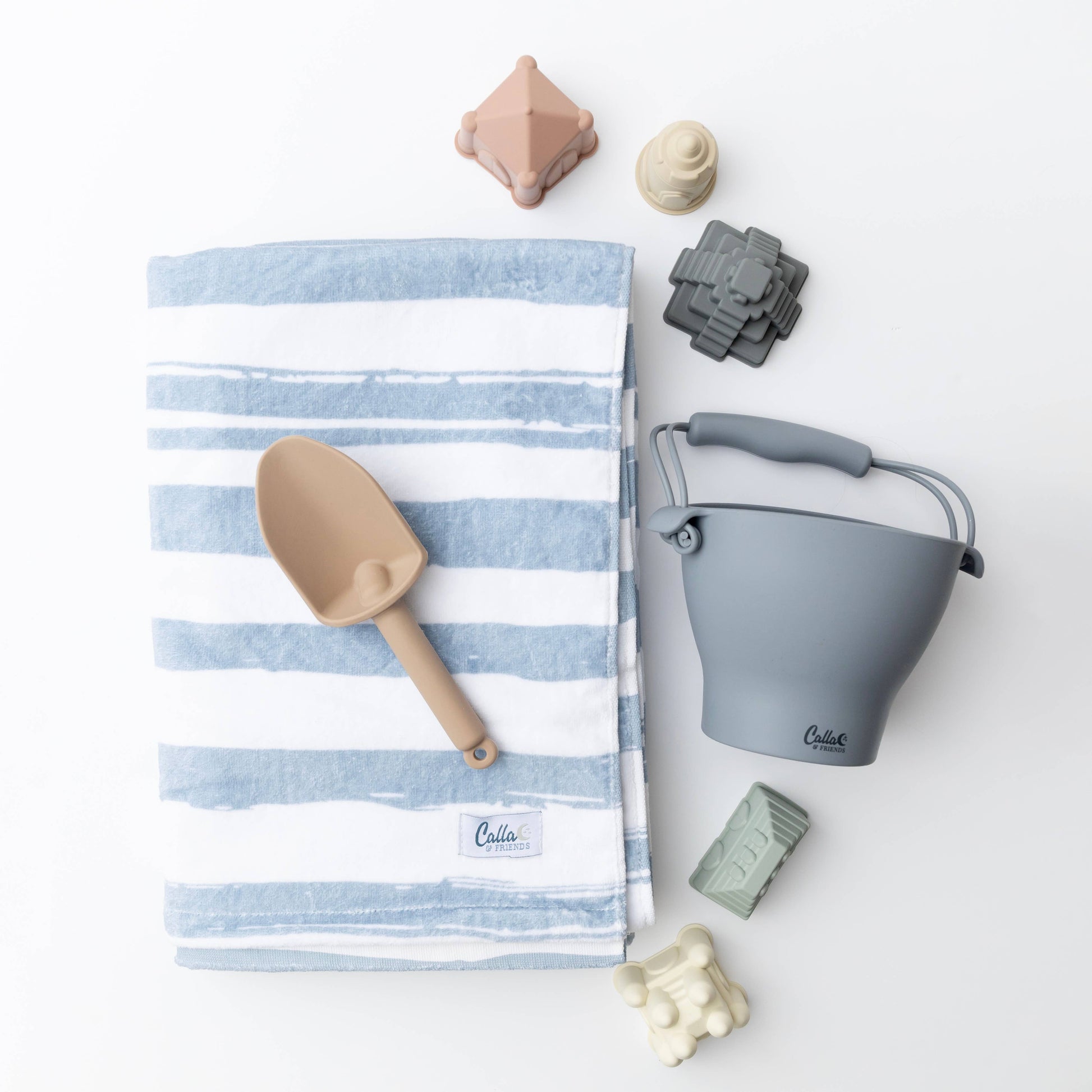 Folded Kenzie Beach Towel with blue brush stripe design