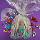 Rainbow sensory kit featuring handmade rainbow swirl glitter dough infused with confetti, miniature sensory charm mix, and soft glitter pompoms. Designed to engage senses and inspire creativity for toddlers and kids ages 3+. Promotes brain development, fine motor skills, and emotional growth. Includes small parts; parental supervision recommended.